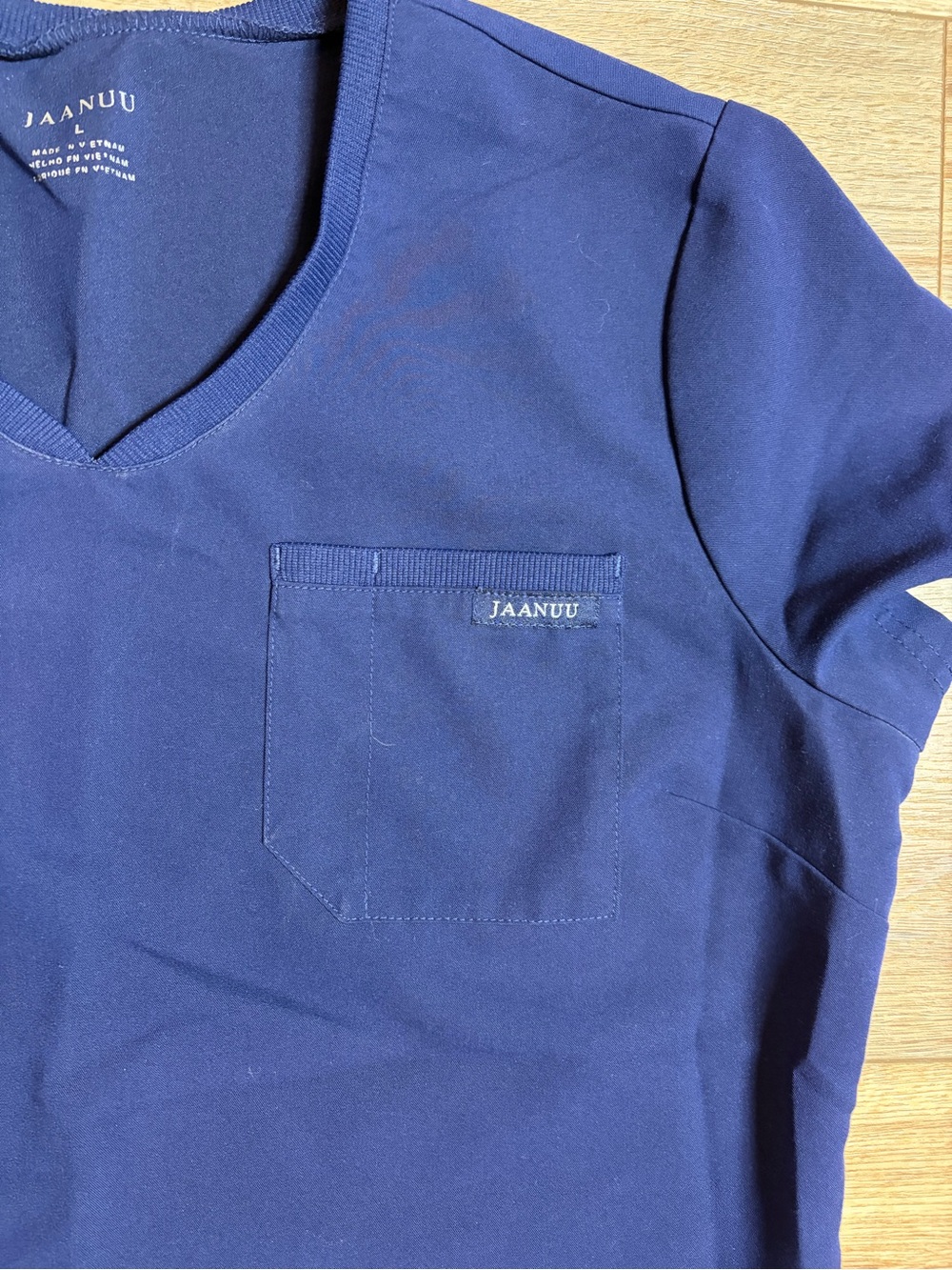 Jaanuu Women's Helia V-Neck Scrub Top in the color Midnight Navy - Picture 3 of 7